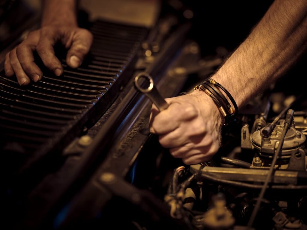 Mechanic working on an engine during diagnostics